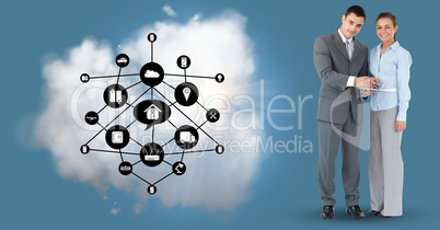 Businesspeople with networking icons and cloud against blue background