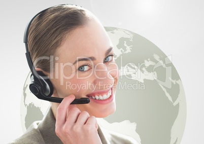 Happy woman talking on headset with globe in background