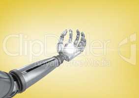 Robot hand with light flare against yellow background