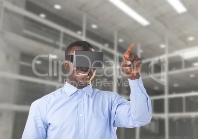Man using virtual reality headset against office in background