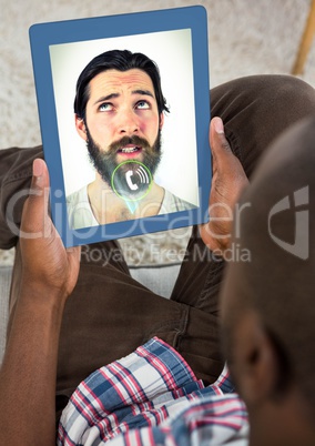 Man having video calling on digital tablet
