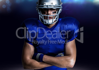 Portrait of american player in helmet standing with arms crossed