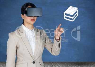Businesswoman using virtual headset pretending to touch book icon against blue background