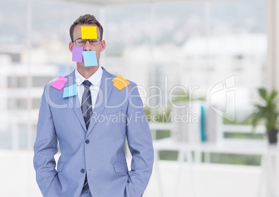 Businessman with blank note over his face