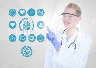 Smiling doctor touching application icons on digital screen