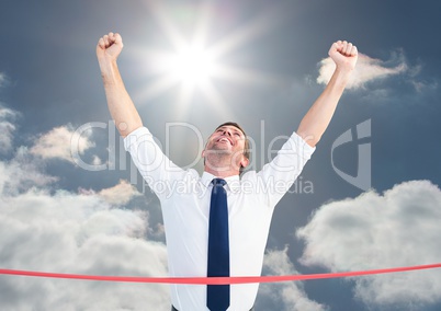 Composite image of businessman wining the race