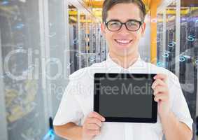 Man holding digital tablet against server room in background
