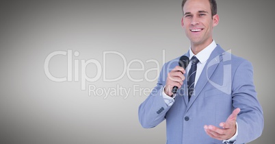 Businessman speaking on microphone