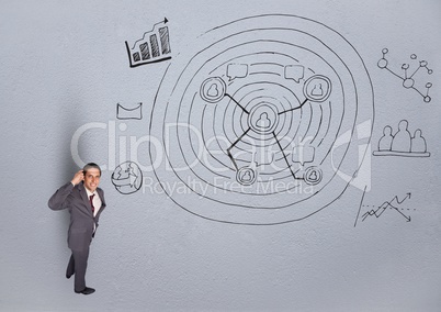 Businessman thinking over graphic plans