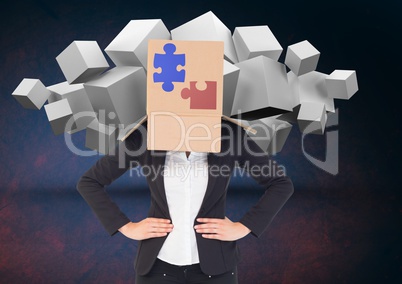 Businesswoman covered with cardboard box showing jigsaw puzzles and white cubes in backgrounds