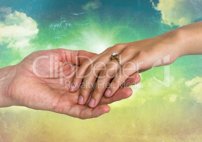 Close-up of engaged couple holding hands each other