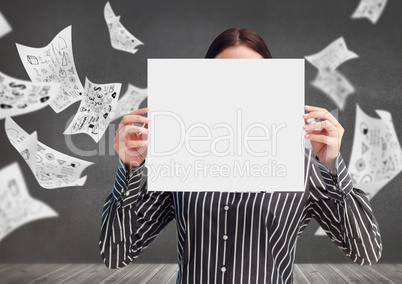 Businesswoman holding blank placard against data graphics in background