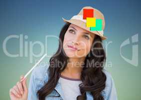Woman holding pencil with sticky notes stuck on her hat