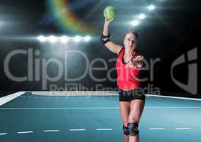 Woman playing handball in stadium