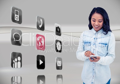 Woman using mobile phone with application icons on grey background