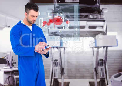 Mechanic writing on clipboard against digital interface