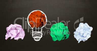 Conceptual image of bulb with multi colored crumpled paper