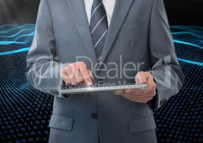 Businessman using digital tablet against binary code interface in background