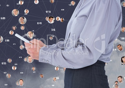 Man using digital tablet with connecting icons in background