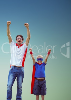 Excited man and father in red cape and blue mask standing with fist