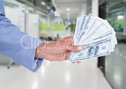 Businessman hand holding dollar banknotes