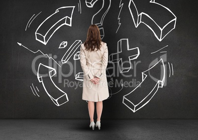 Businesswoman looking at business plan concept on blackboard