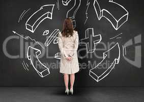 Businesswoman looking at business plan concept on blackboard