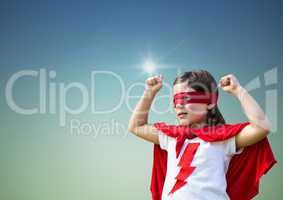Girl in superhero costume showing fists