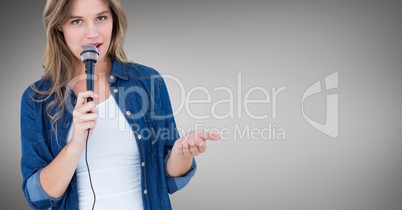 Female executive speaking over microphone