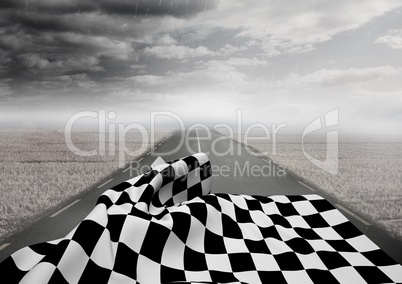 Checkered flag on road against stormy sky