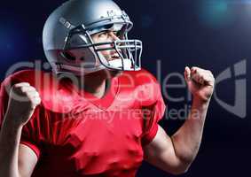 Excited american player standing against blue background