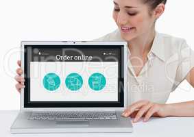 Smiling woman showing online application on laptop screen