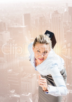 Businesswoman holding briefcase and running against cityscape