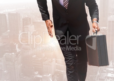 Digital composite image of businessman walking with a suitcase