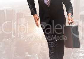 Digital composite image of businessman walking with a suitcase