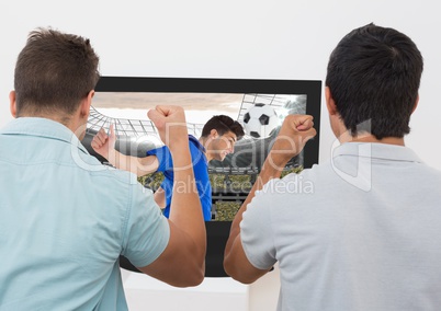 Two excited men cheering while watching football match on tv