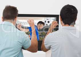 Two excited men cheering while watching football match on tv