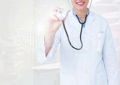Doctor examining with stethoscope in operating room