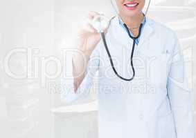 Doctor examining with stethoscope in operating room