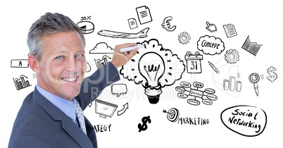 Businessman drawing against business doodles on white background