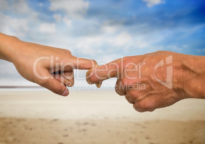 Close-up of male and female hands holding fingers