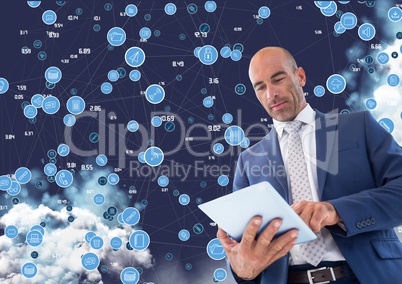 Businessman using digital tablet against cloud computing background