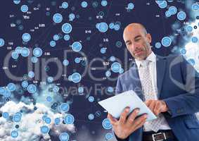 Businessman using digital tablet against cloud computing background
