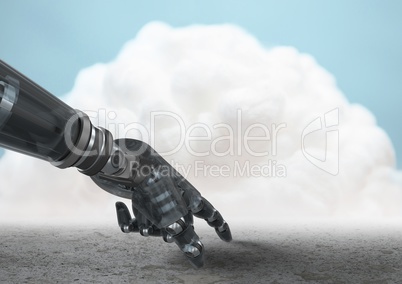 Robot hand pointing to ground with cloud in background