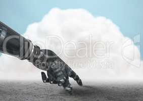Robot hand pointing to ground with cloud in background