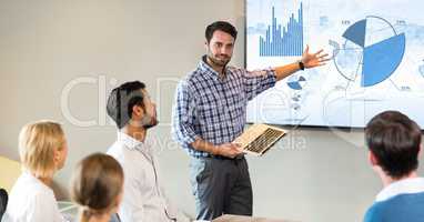 Businessman giving presentation to his colleagues