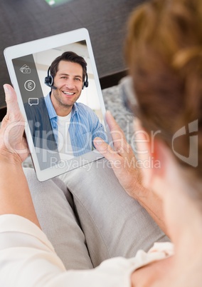 Woman having video calling on digital tablet