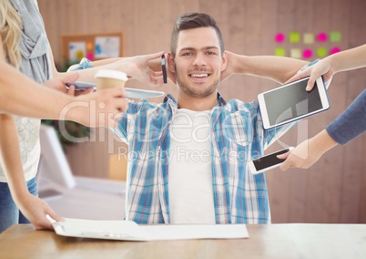 Relaxed businessman with hands holding electronic devices