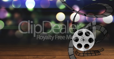 Film reel against bokeh background