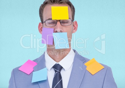 Businessman with black sticky notes on face
